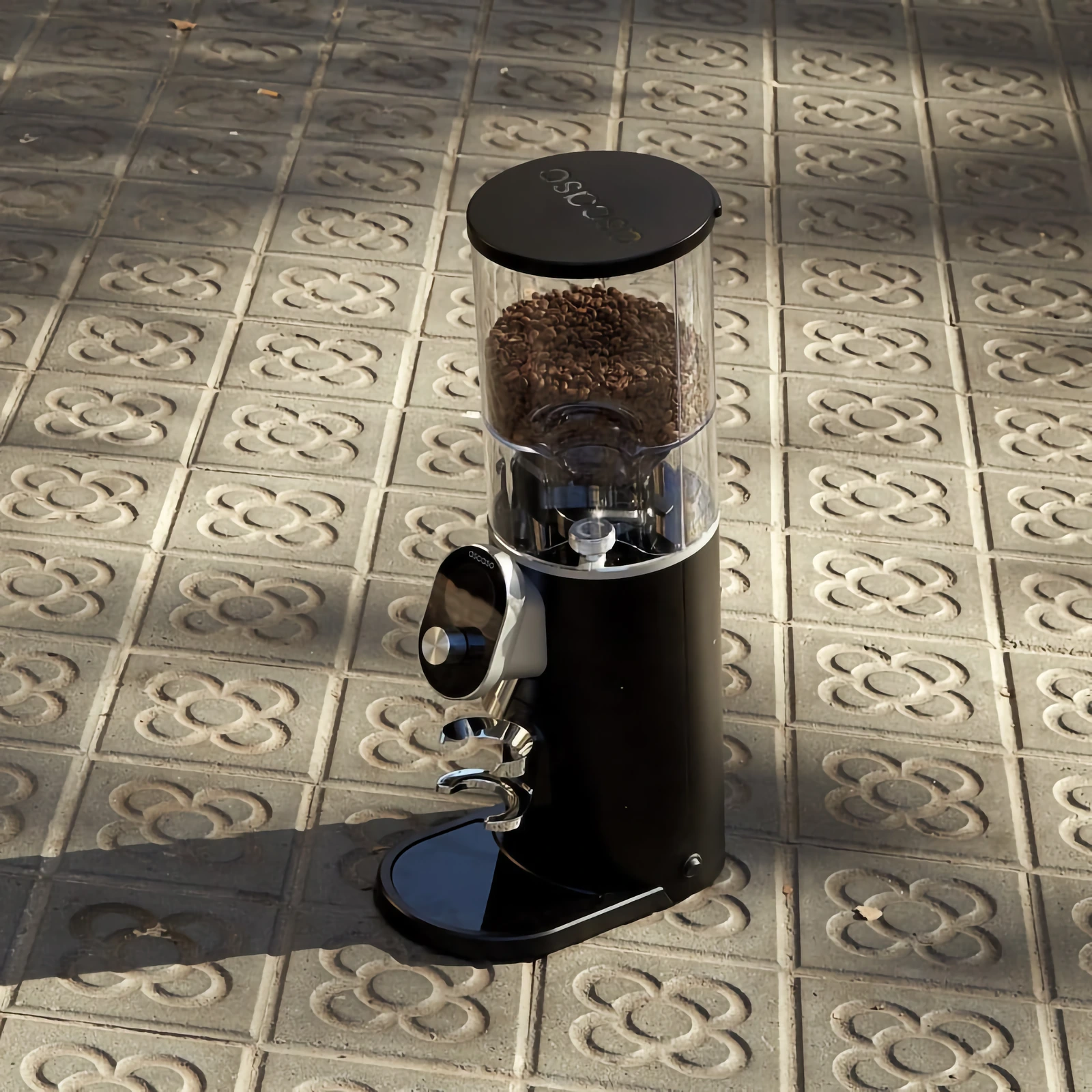 „Ascaso“ P74, its hopper filled with beans, on sunlit floor tiles